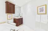 Step into a luxurious bathroom featuring a sleek design and modern amenities.