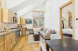 This charming property features a well-appointed kitchen with modern appliances and ample counter space.