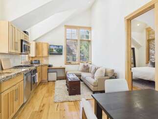 This charming property features a well-appointed kitchen with modern appliances and ample counter space.