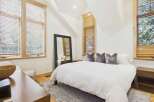 This stunning bedroom boasts a modern design with a touch of elegance.