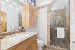 Step into luxury with this stunning bathroom! Featuring a sleek glass shower, elegant vanity, and ample storage, this space is designed for both style and functionality.
