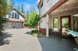 Experience rustic charm with this stunning property featuring a weathered wood exterior and corrugated metal accents.