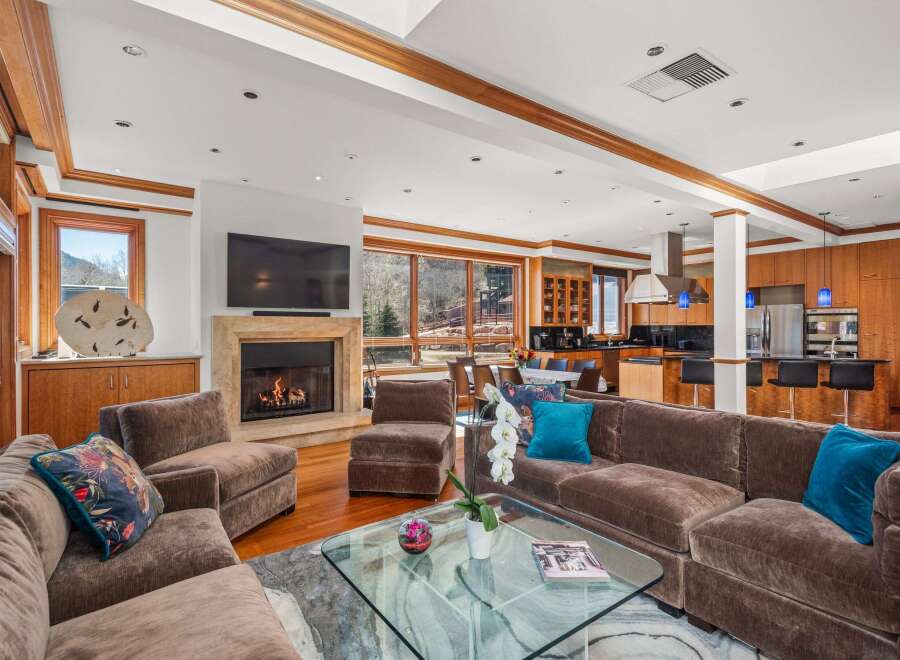 Experience luxury living in this stunning property featuring a cozy fireplace, perfect for chilly evenings.