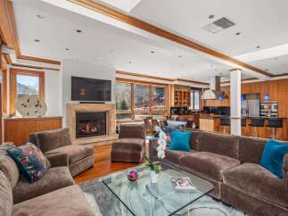 Experience luxury living in this stunning property featuring a cozy fireplace, perfect for chilly evenings.
