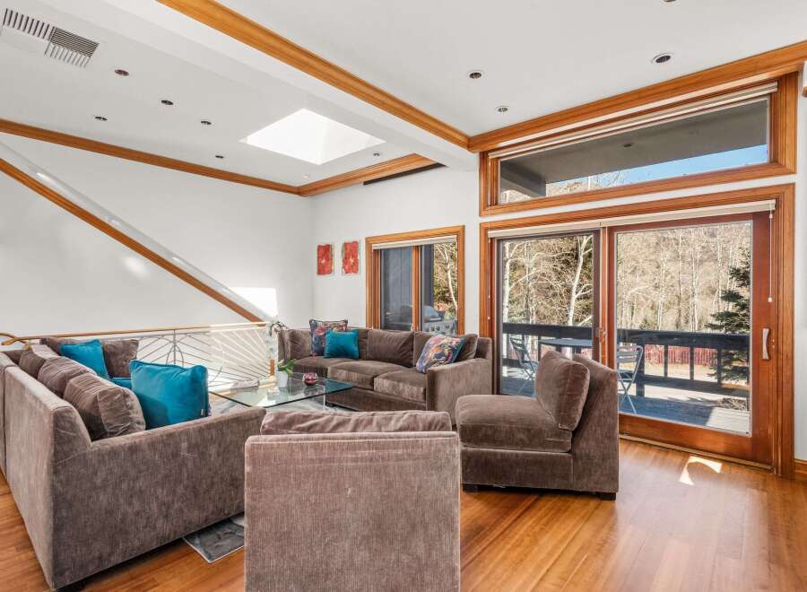 This stunning living room boasts a modern design with a touch of elegance.