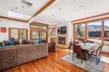 Experience luxury living in this stunning property, featuring a cozy fireplace and a spacious living area.