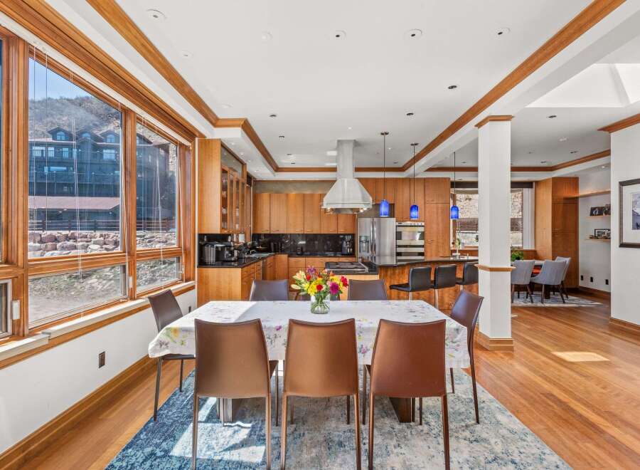 Experience luxury living in this stunning property, featuring a beautifully designed dining area.