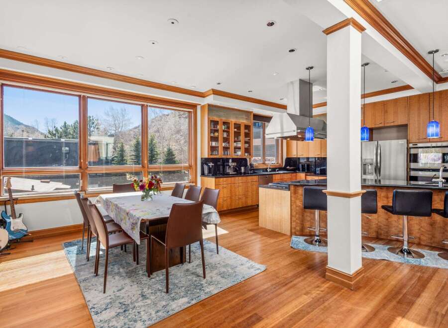 Experience luxury living in this stunning home featuring a gourmet kitchen with stainless steel appliances and a breakfast bar.