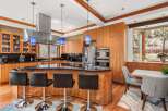 This stunning kitchen boasts a modern design with sleek cabinetry and a spacious island.