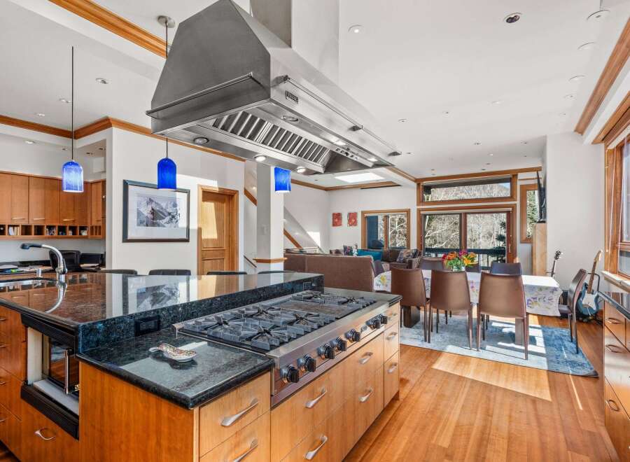 This stunning kitchen boasts a modern design with high-end appliances and ample counter space.