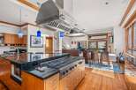 This stunning kitchen boasts a modern design with high-end appliances and ample counter space.