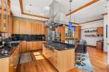 This stunning kitchen boasts a modern design with high-end appliances and custom cabinetry.