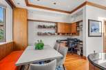 This stunning home office features custom cabinetry and a built-in desk, perfect for productivity.