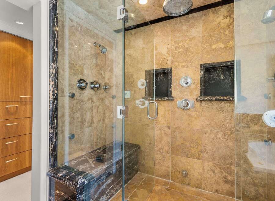 Step into luxury with this stunning bathroom featuring a spacious walk-in shower.