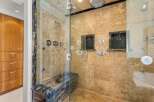 Step into luxury with this stunning bathroom featuring a spacious walk-in shower.