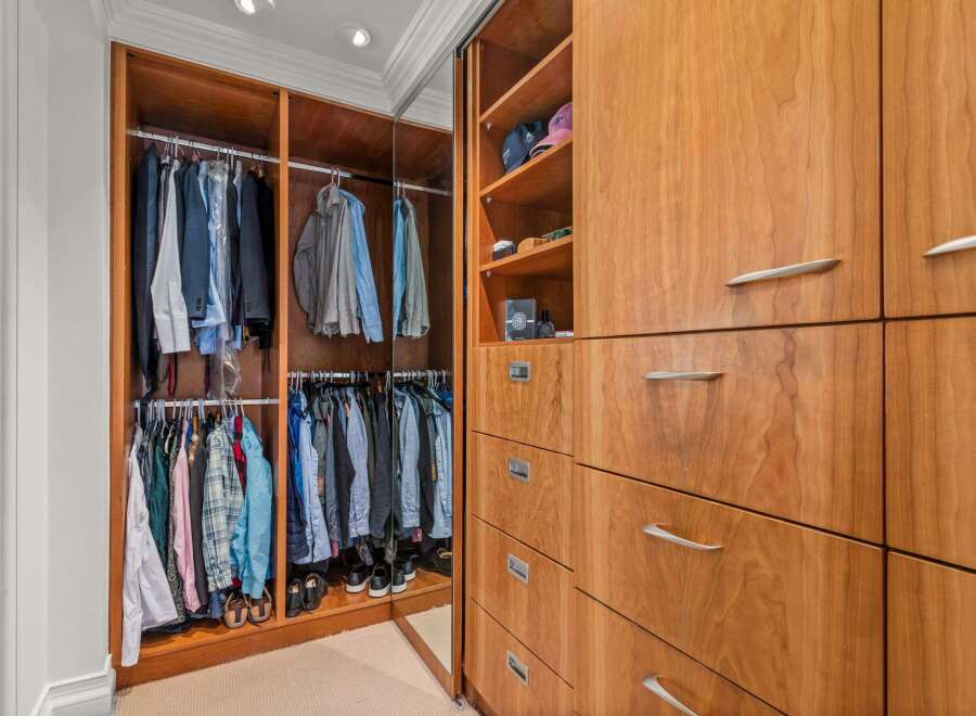 This stunning walk-in closet offers ample storage and organization for your wardrobe.