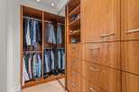 This stunning walk-in closet offers ample storage and organization for your wardrobe.