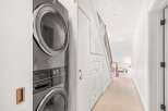 Discover the epitome of modern living with this stunning property, showcasing a sleek and efficient Electrolux washer and dryer set.