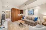 Discover modern living in this stylish property, featuring a cozy living area with a comfortable sofa and a unique coffee table.