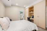This bedroom offers a blend of comfort and functionality, perfect for relaxation and productivity.