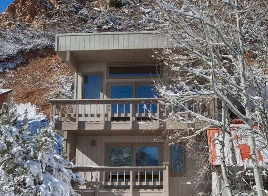 Nestled in a picturesque mountain setting, this stunning property offers a serene retreat.