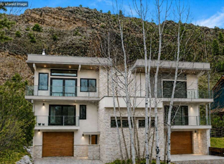 This stunning modern home offers a luxurious living experience with its sleek design and high-end finishes.