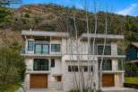 This stunning modern home offers a luxurious living experience with its sleek design and high-end finishes.