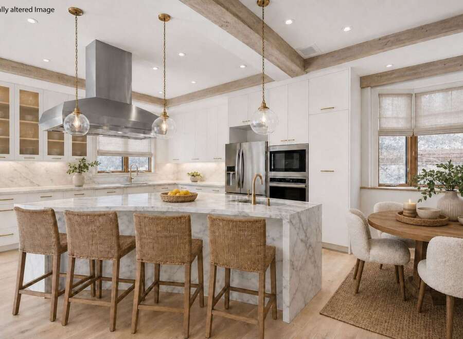 This stunning kitchen boasts a luxurious marble island with seating, perfect for entertaining.