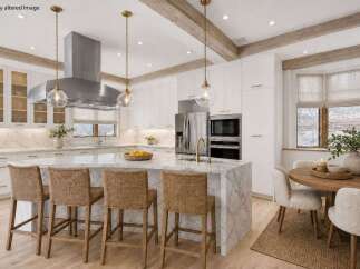 This stunning kitchen boasts a luxurious marble island with seating, perfect for entertaining.