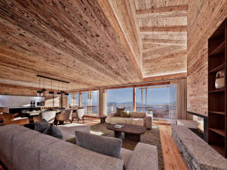 Experience luxury living in this stunning chalet, featuring exquisite wooden interiors and breathtaking mountain views.