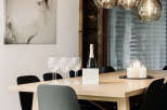 This dining area exudes modern elegance with its minimalist design and natural wood elements.