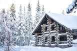 This stunning log cabin offers a serene escape in a winter wonderland.