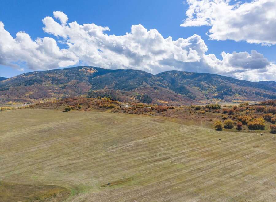 Discover the tranquility of this stunning property, nestled amidst breathtaking mountain views and expansive fields.