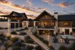 Experience luxury mountain living in this stunning modern home, featuring a spacious multi-level design with expansive windows and natural wood accents.