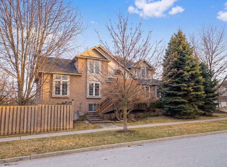 This stunning two-story home boasts a beautiful brick exterior and a well-manicured lawn, offering excellent curb appeal.