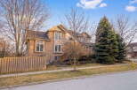 This stunning two-story home boasts a beautiful brick exterior and a well-manicured lawn, offering excellent curb appeal.