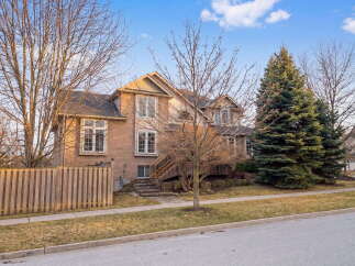 This stunning two-story home boasts a beautiful brick exterior and a well-manicured lawn, offering excellent curb appeal.