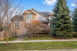 This stunning two-story home boasts a beautiful brick facade and a well-manicured lawn, offering excellent curb appeal.