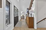 Step into this inviting entryway, showcasing a blend of classic and contemporary design.