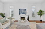 This stunning living room boasts a bright and airy atmosphere, perfect for relaxation and entertaining.