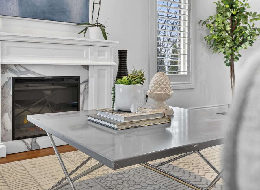 This stunning property boasts a modern fireplace, perfect for cozy evenings.
