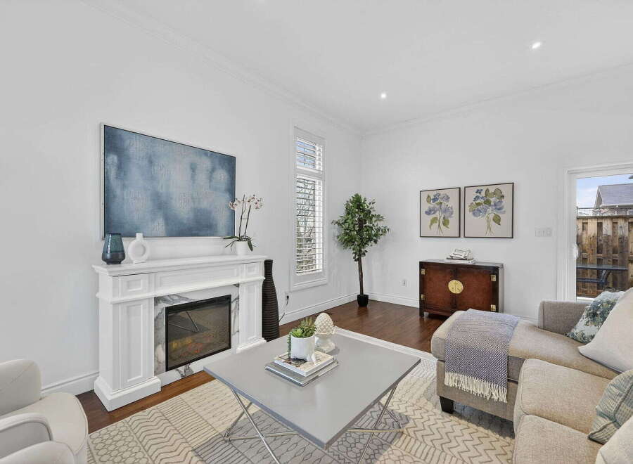 This stunning living room boasts a modern fireplace, perfect for cozy evenings.