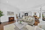 Step into luxury with this stunning property, featuring a spacious living area perfect for entertaining.