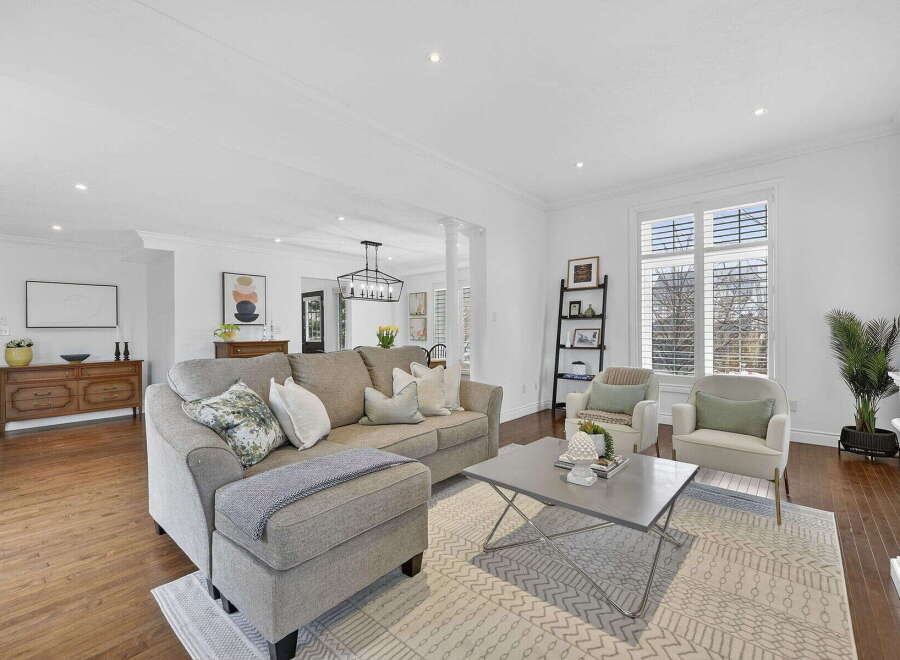Step into luxury with this stunning living room! Featuring a cozy sectional sofa, elegant armchairs, and a stylish coffee table, this space is perfect for relaxation and entertaining.