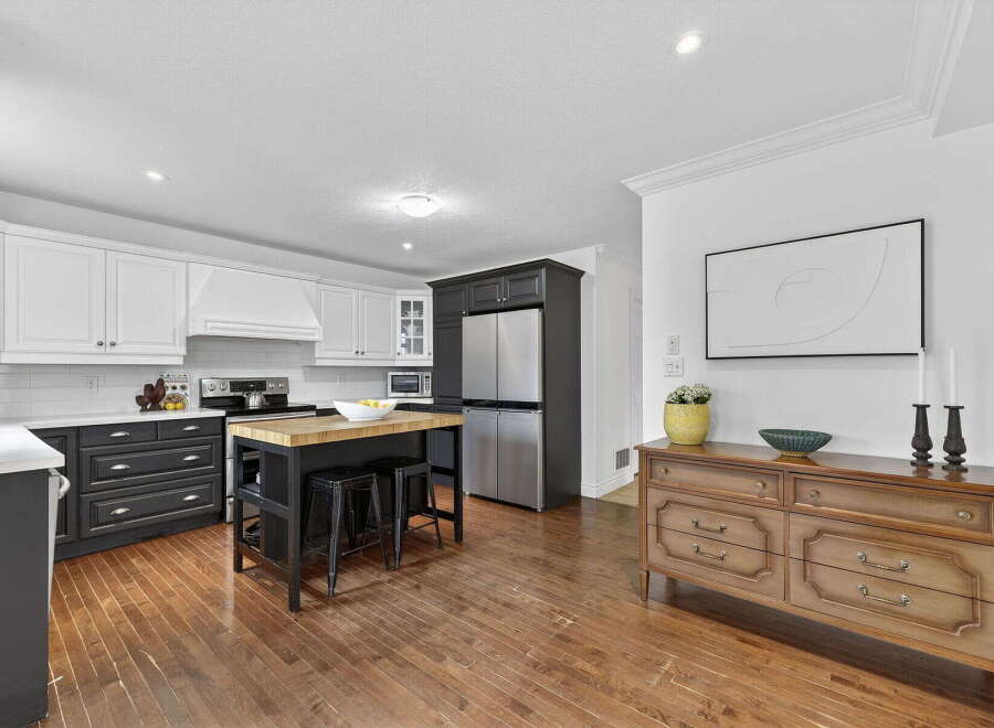 This stunning kitchen boasts a modern design with sleek cabinetry and stainless steel appliances.