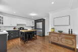 This stunning kitchen boasts a modern design with sleek cabinetry and stainless steel appliances.