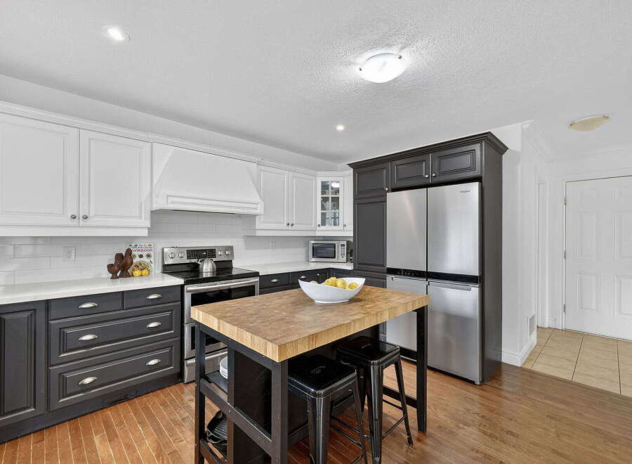This stunning kitchen boasts a modern design with a perfect blend of style and functionality.