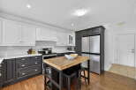 This stunning kitchen boasts a modern design with a perfect blend of style and functionality.