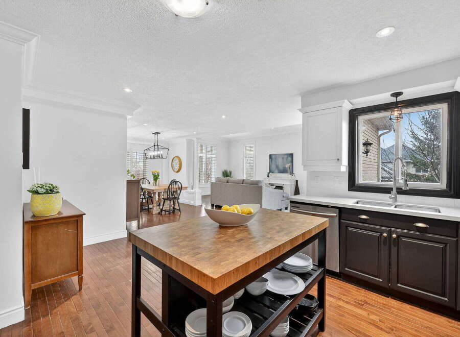 This stunning kitchen boasts a spacious layout, perfect for both cooking and entertaining.