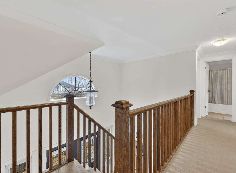 Step into this stunning home and be greeted by a beautifully designed staircase.